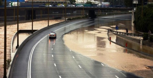 A police car drives down a flooded road as storms disrupt the road network and rail system on January 8, 2013, in the Mediterranean coastal city of Tel Aviv. (Jack Guez - AFP/Getty Images)