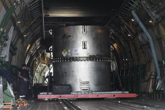A special container carrying highly enriched uranium is loaded onto a cargo plane for repatriation to Russia.