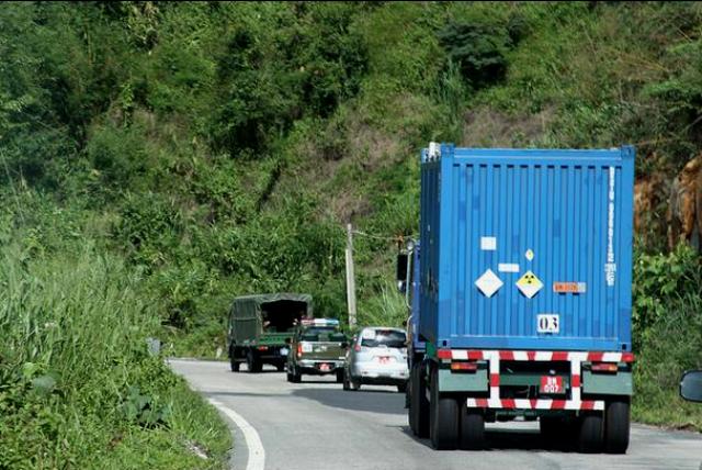 A truck carrying the last highly enriched uranium in Vietnam winds through the Vietnamese countryside.