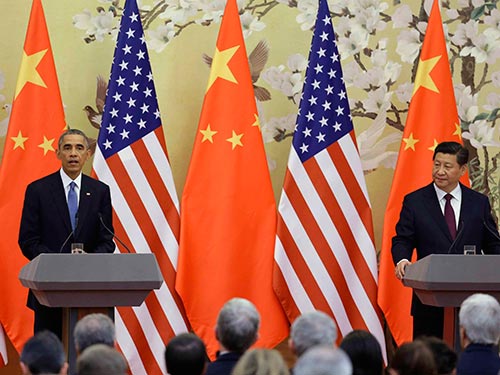 Tổng thống Mỹ Barack Obama (trái) và Chủ tịch Trung Quốc Tập Cận Bình tại cuộc họp báo chung hôm 12-11 (Ảnh: REUTERS)
