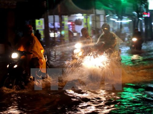 Ngập úng ở đường Vườn Lan, quận Tân Bình, Thành phố Hồ Chí Minh, ngày 26/9. (Ảnh: Hoàng Hải/TTXVN)